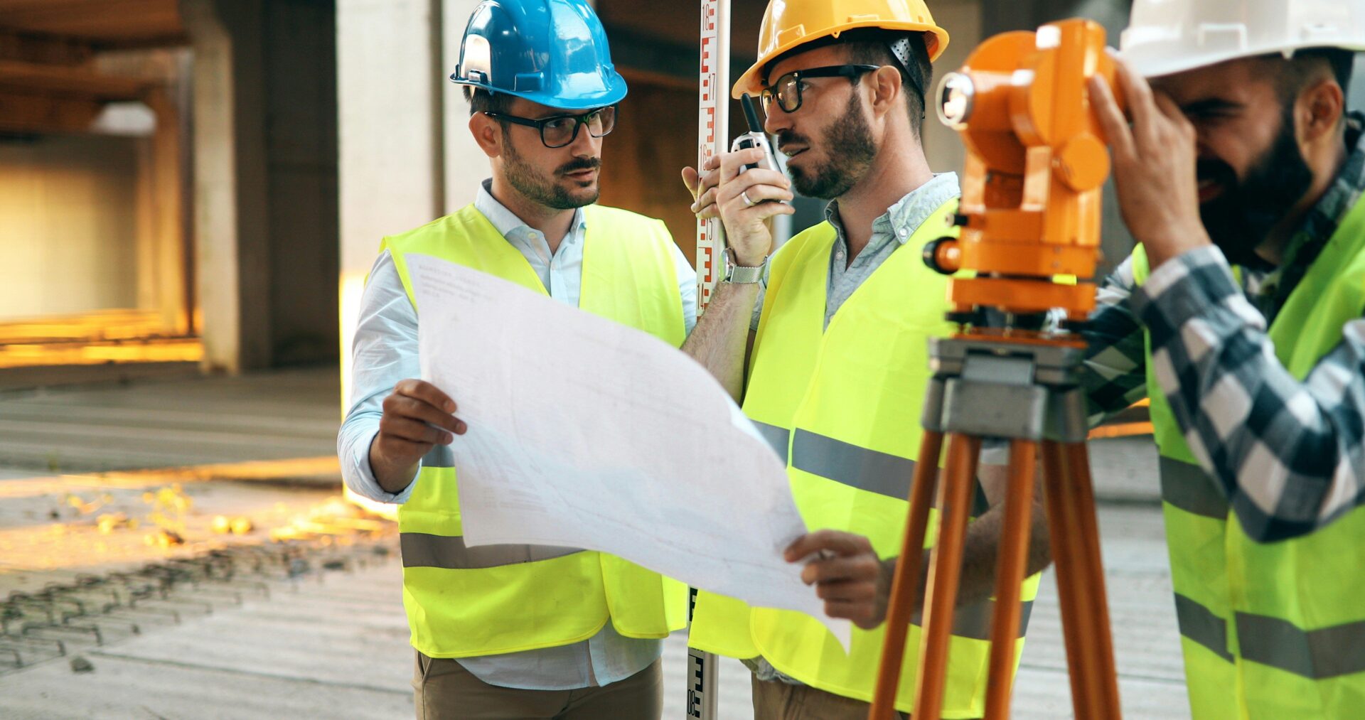 Project consultant talking to two builders